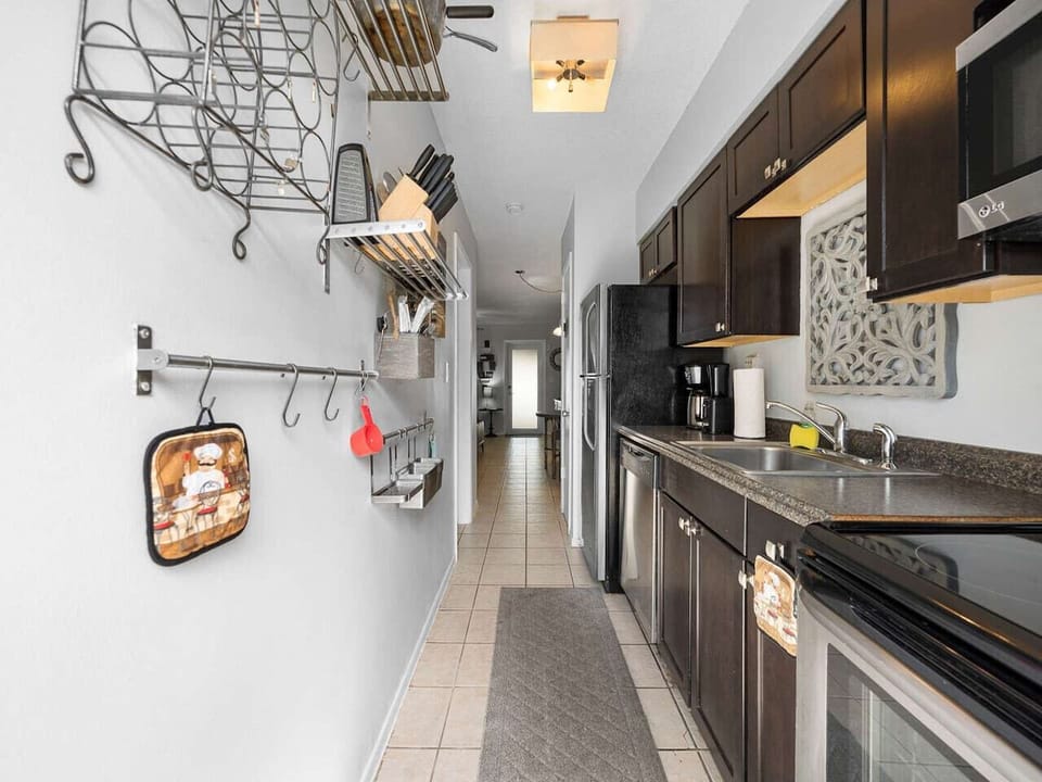 Kitchen: A perfect blend of modern sophistication and warm, functional design.