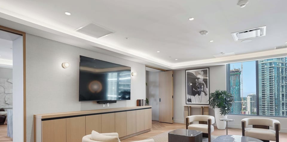 Comfortable seating with large TV for relaxing.