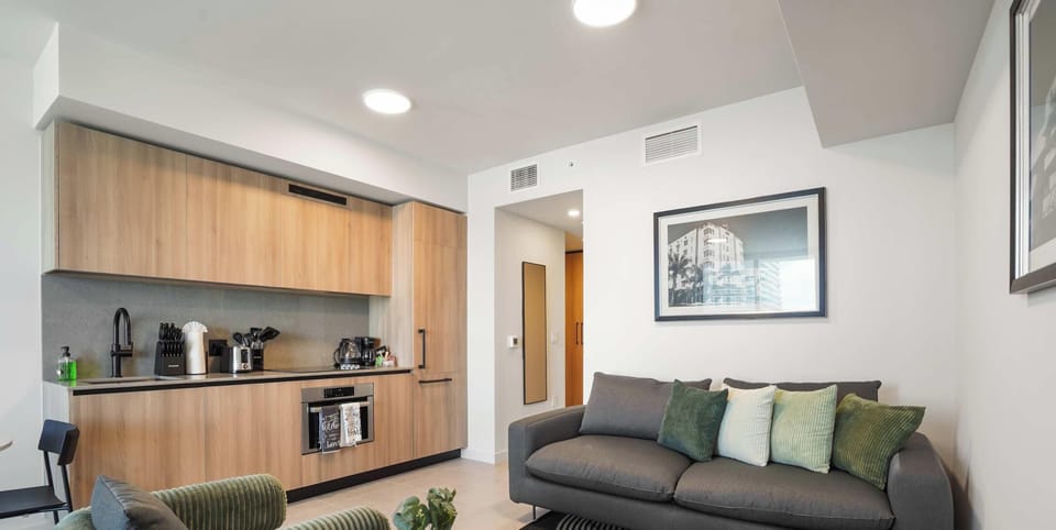 Relaxed seating area with smart TV and city views