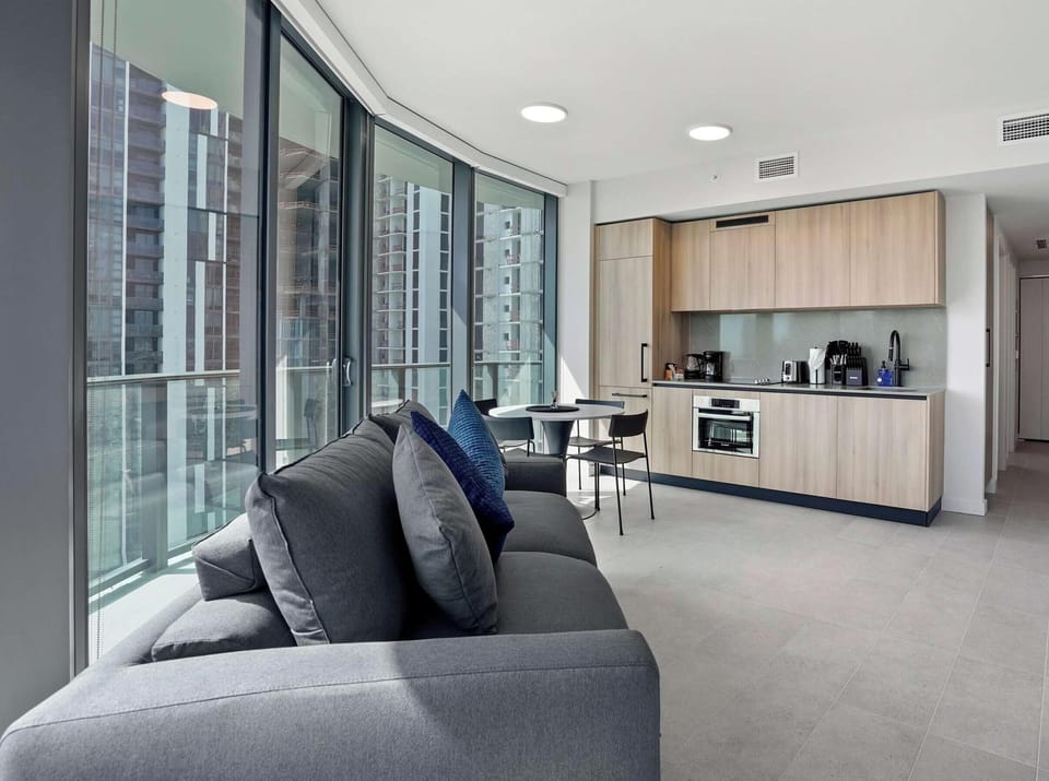 Natural light and skyline views throughout the space.