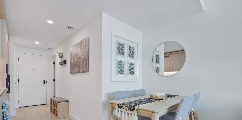 Modern entryway and dining space with clean lines and natural light.