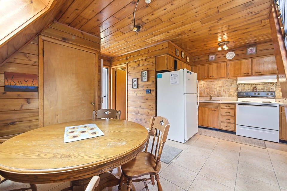 Chalet #74 combines a full kitchen and dining area, making meals easy between beach days and resort activities.