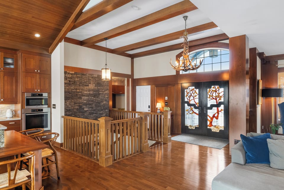 Step through the handcrafted stained glass doors into lodge luxury. The antler chandelier sets the tone from the moment you arrive.