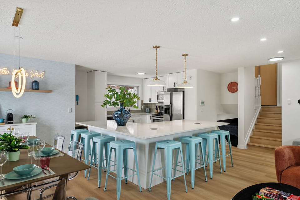 Eight stools line the oversized island, perfect for morning pancakes & late-night conversations. Pop-up outlets & charging pads built in so you can stay charged up while you eat.