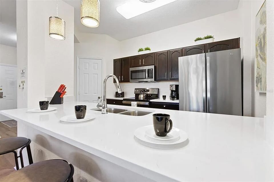 Open design makes way for extended countertop and extra seating in the dining area
