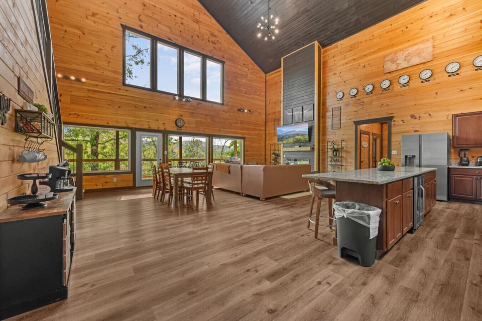 Cabin 1: Spacious living room with comfortable seating, TV, and a cozy lounge area.