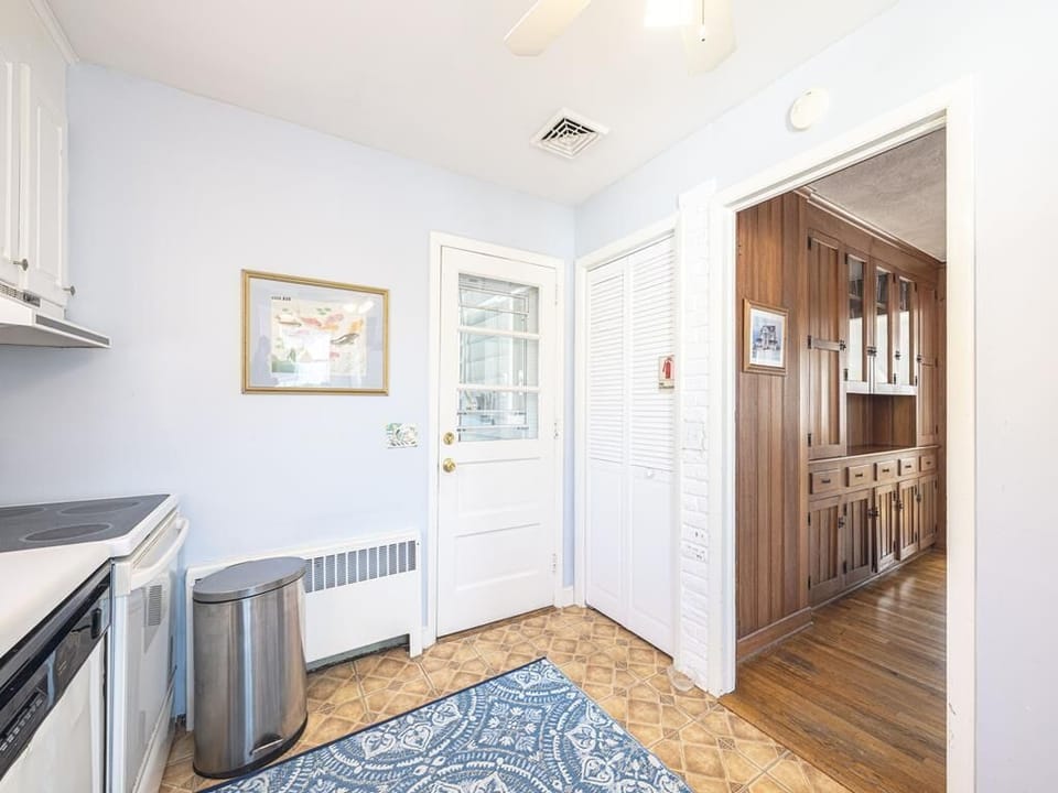 Conveniently connect the kitchen to nearby spaces, overlooking a welcoming entryway.