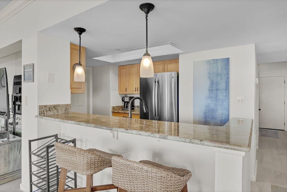 Kitchen with granite countertops and stainless steel appliances.