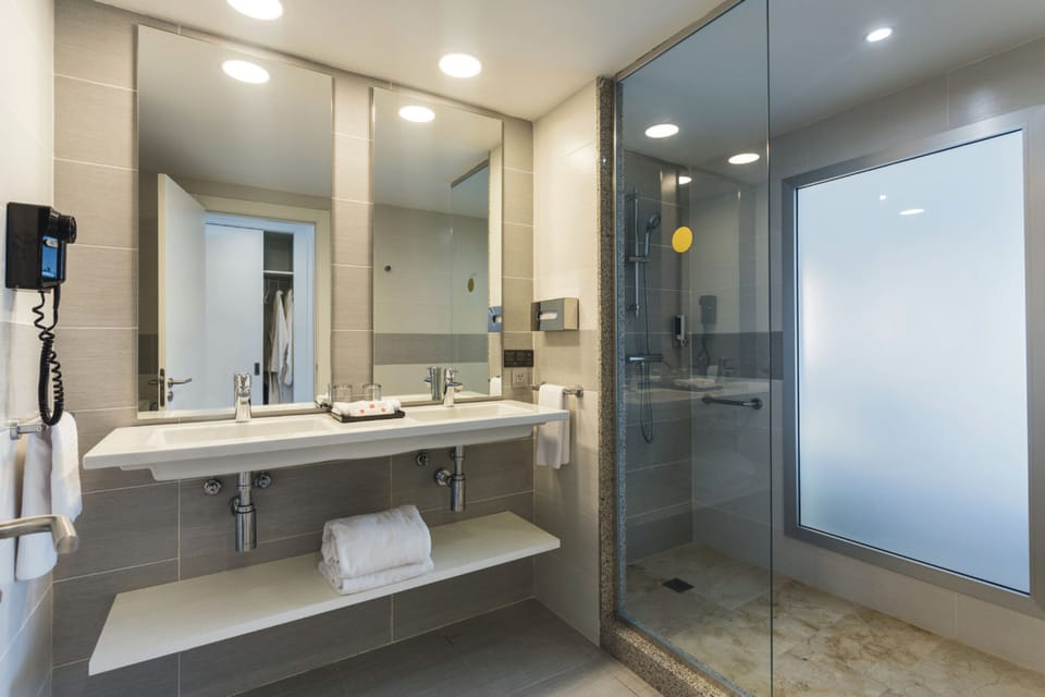 Shower, eco-friendly toiletries, hair dryer, slippers
