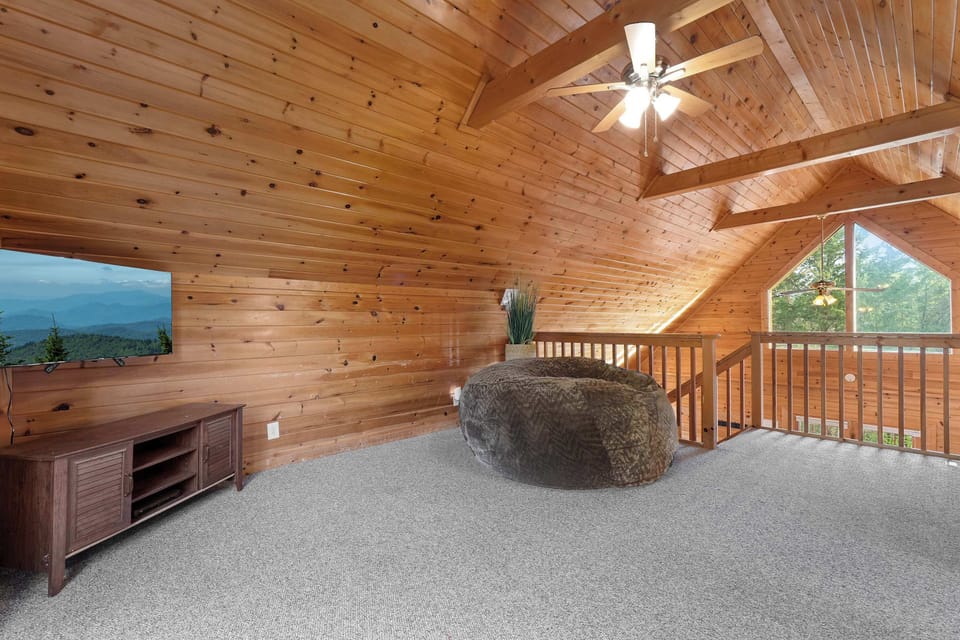 Sink into the bean bag up here for the movie nobody else wants — you get the whole loft TV to yourself this afternoon.