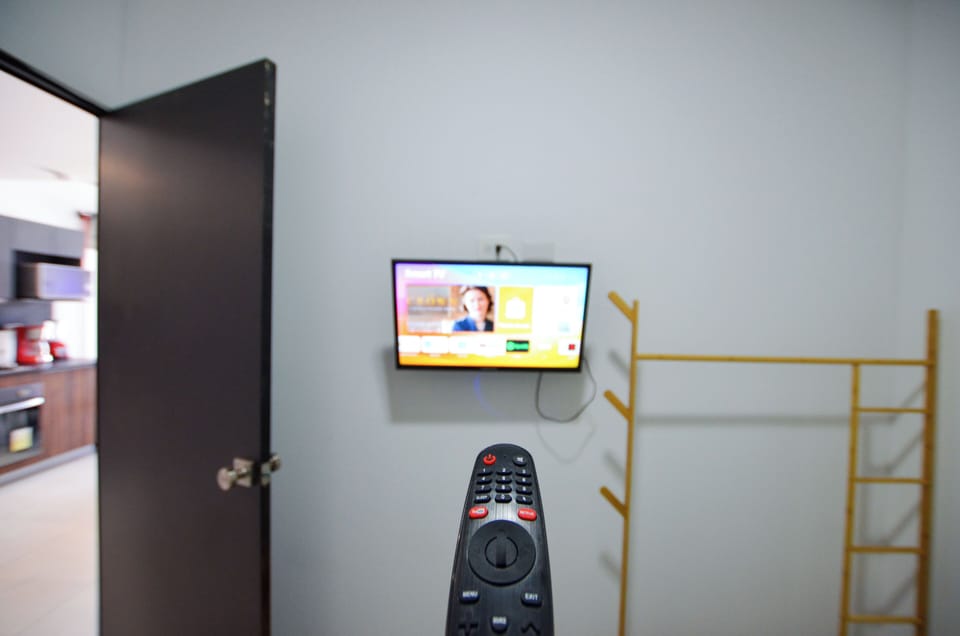 Comfort Suite, Balcony, City View | Television