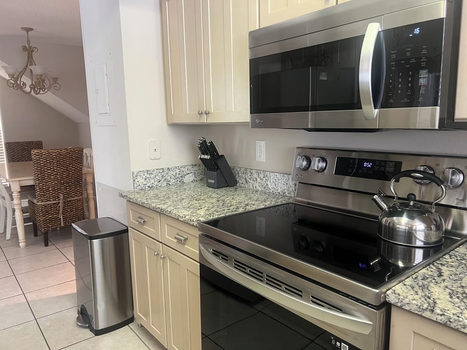 Your fully equipped kitchen awaits with granite counters, stainless appliances, and everything needed to create memorable meals together.
