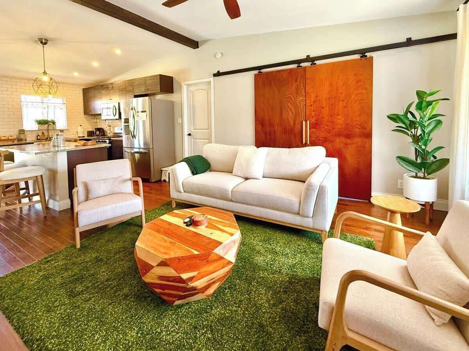 Our living room is equipped with a 65” Smart TV with streaming apps for your entertainment. We also have an overhead fan, books, and games.