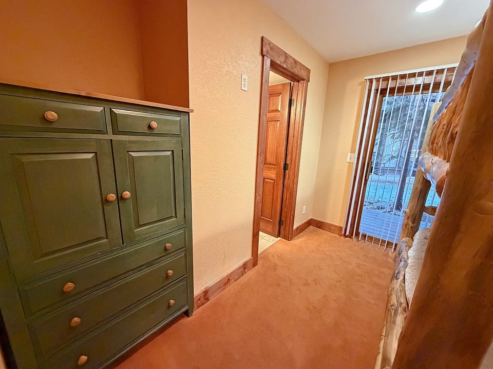 Bedroom #3 with Queen-over-Queen bunk beds and attached bathroom.