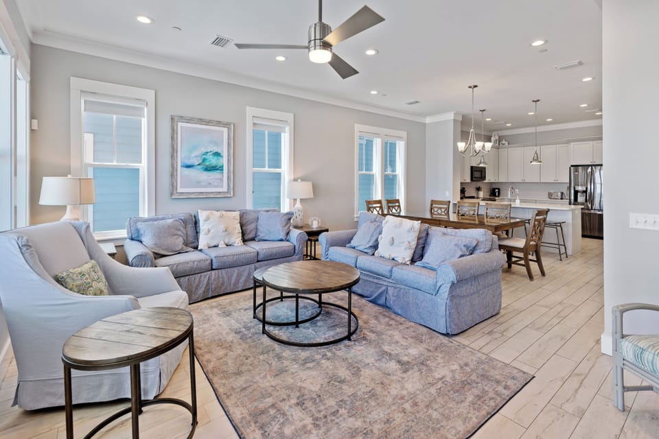 Sink into plush coastal comfort with panoramic sea views filling every window of your open-concept retreat.