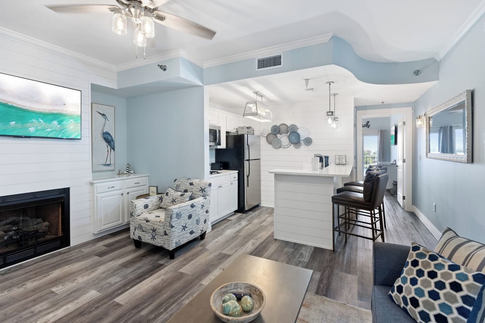 Your bright, coastal-inspired home features an open layout where you can cook, dine, and relax in soothing blue tones and beachy decor.