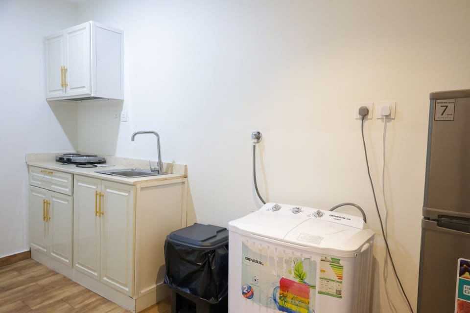 Suite, City View | Private kitchen | Fridge