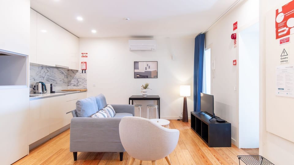 Unwind in the inviting open-plan living area, where you can relax on the cozy sofa, enjoy a meal at the compact dining table, or prepare light snacks in the well-appointed kitchenette. This versatile space offers both comfort and functionality.