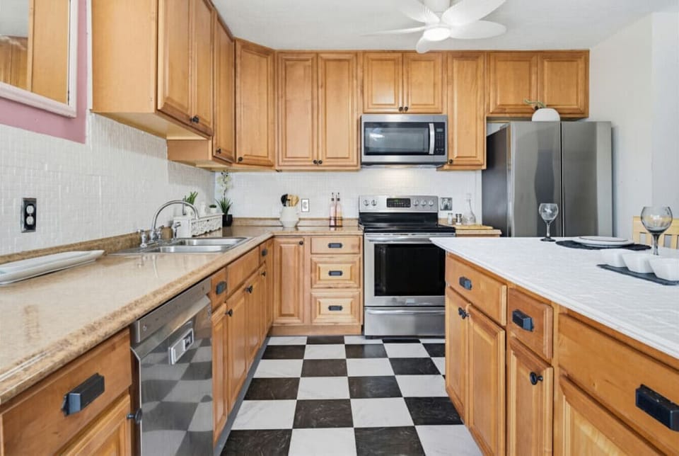 Main House Kitchen | Stainless Steel Appliances | Tile Flooring & Cabinet Storage