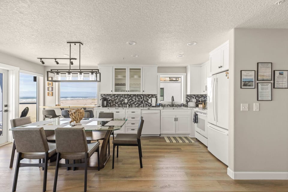 Fully equipped kitchen with dining space and breathtaking ocean views for the ultimate beachfront experience.
