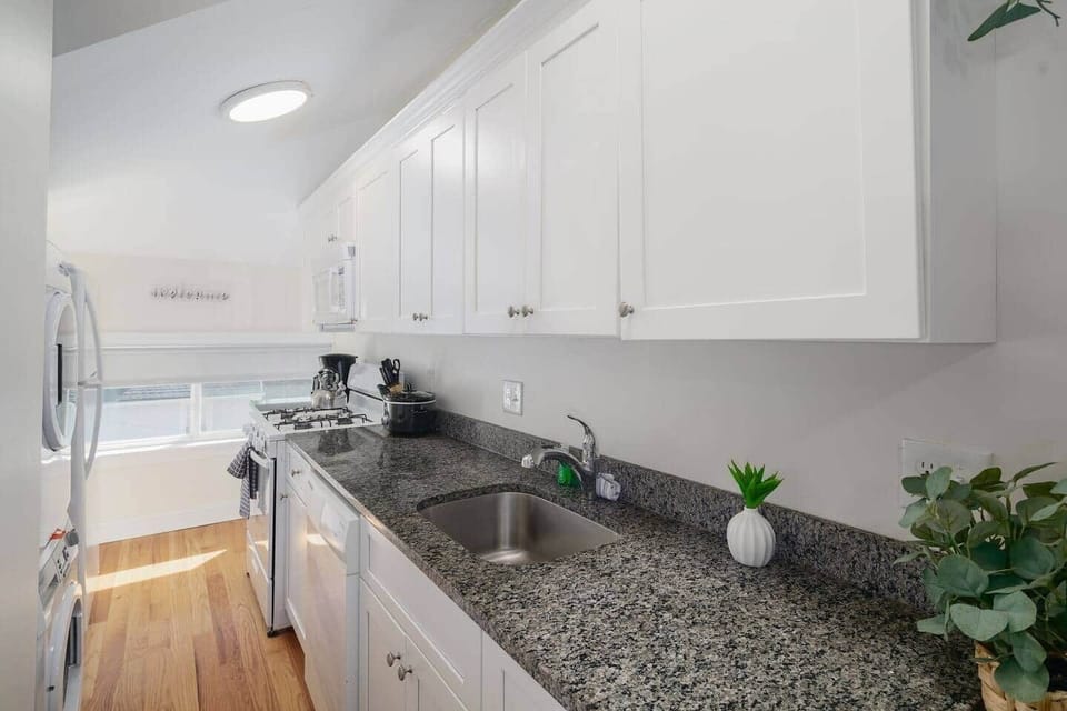 Full kitchen with dishwasher. 