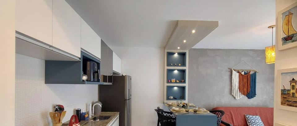 Deluxe Apartment | Private kitchen | Full-size fridge, microwave, cookware/dishes/utensils, dining tables