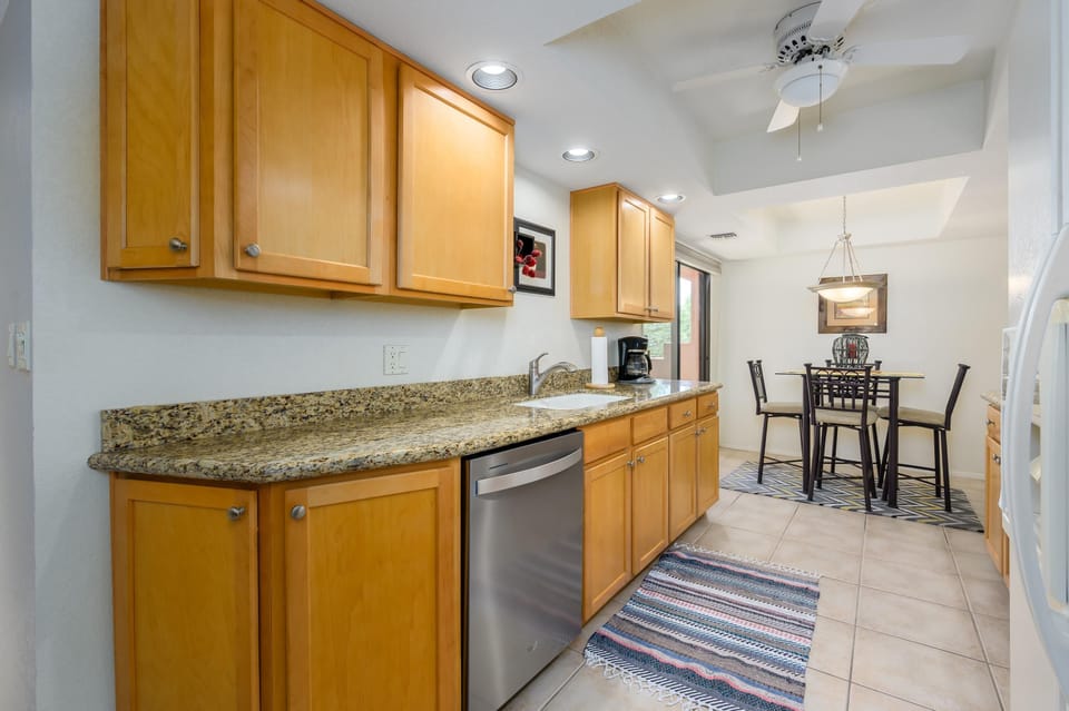 Bright kitchen with granite counters and cozy dining nook
