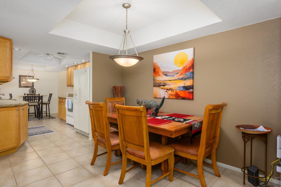 Cozy dining area with warm lighting and modern kitchen access