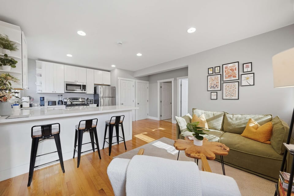 Open-concept living and dining area with contemporary decor.