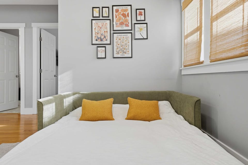 Sofa bed in the living room with accent pillows and cozy design.