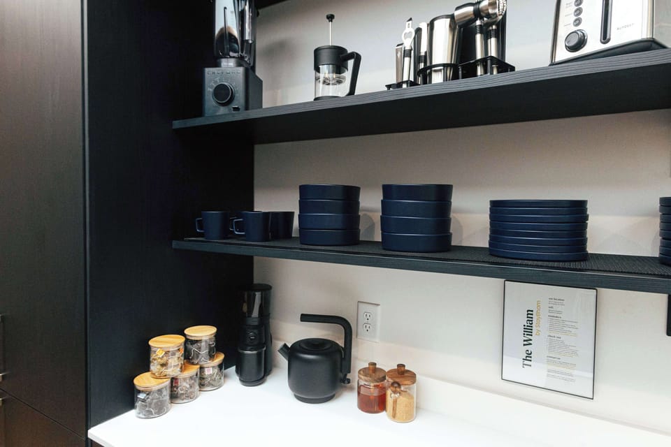 The heart of the loft: stocked with essentials, premium small appliances, and ready for your next culinary adventure.