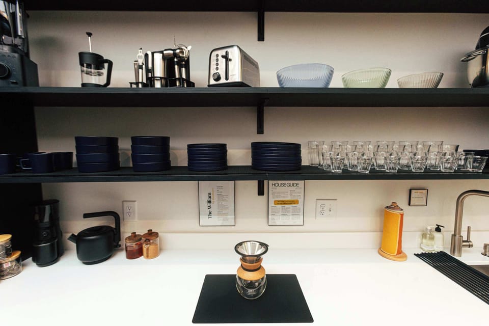Every StayBham loft begins with light, warmth, and design—showcased in this stylish, functional kitchen.