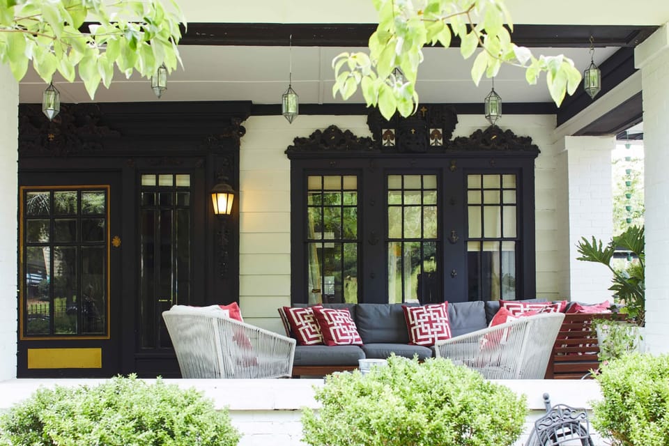 Step outside the apartment to the front porch. Enjoy a cocktail on the lounge sofa while you overlook the property's front garden.