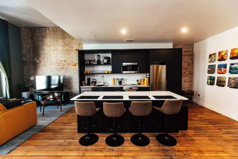 Fully equipped kitchen with everything you need — from quality cookware to curated details. Spacious island doubles as a dining nook or workspace. 