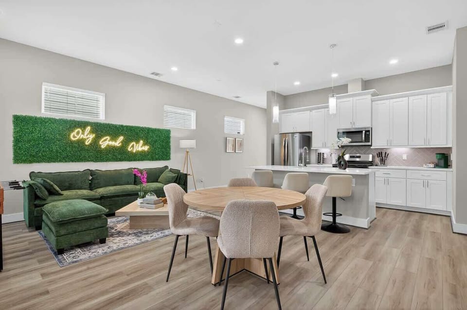 Dining Room: Bright and airy space featuring a stylish round table and lush greenery for vibrant meals!