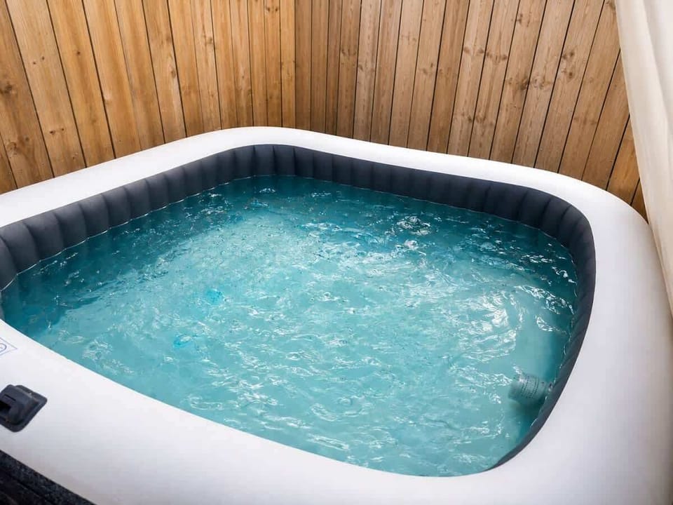 Hot Tub Haven: Dive into relaxation with your private bubbling retreat!