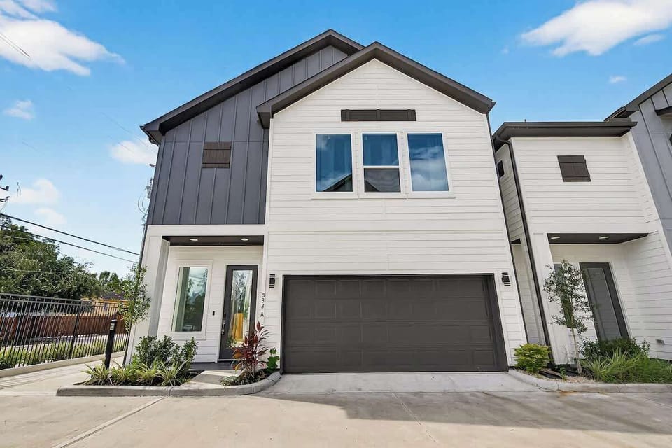 Contemporary home design with private driveway and garage access.