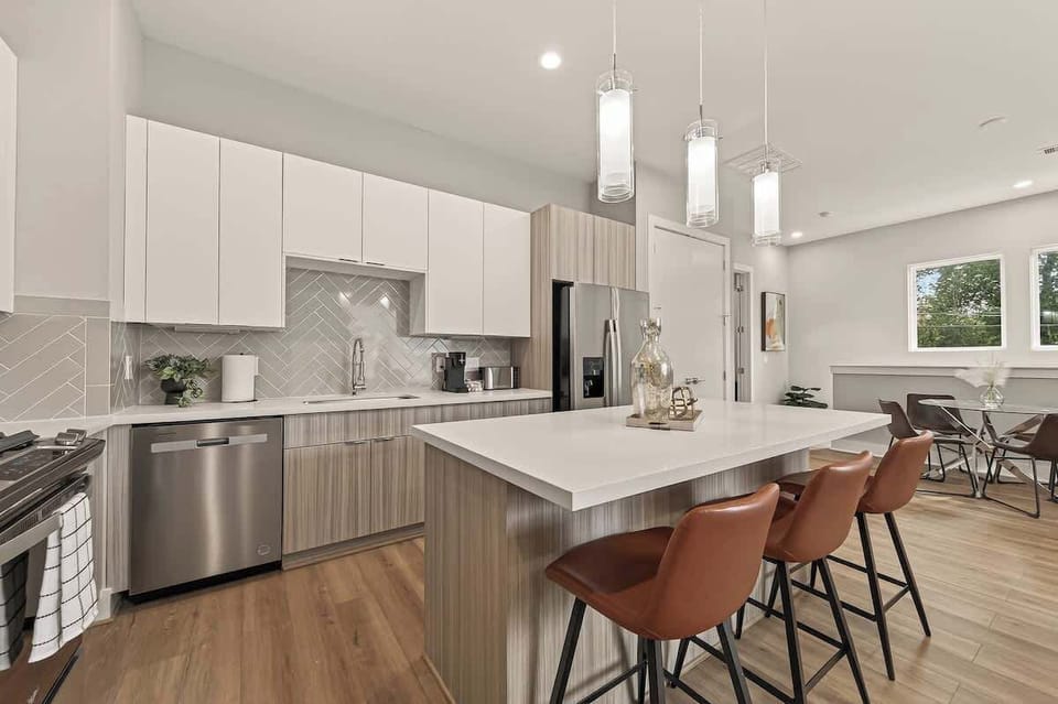 Enjoy morning coffee or a cozy dinner at this sleek glass-top table. A clean, minimalist space that overlooks the treetops.