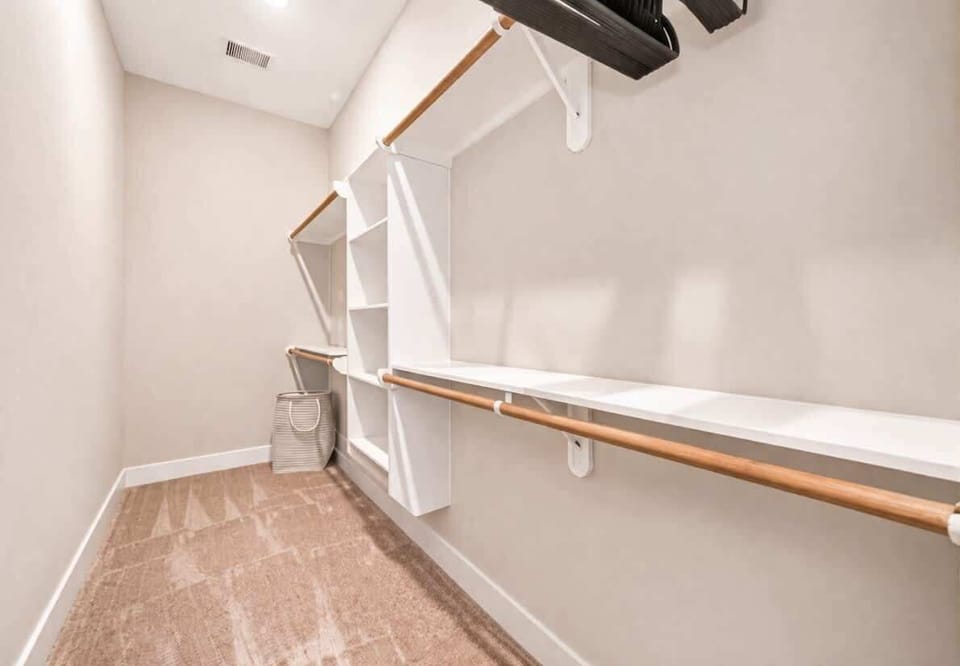 Walk-in Closet: Organize in style with extensive shelving and racks for all your favorite outfits!
