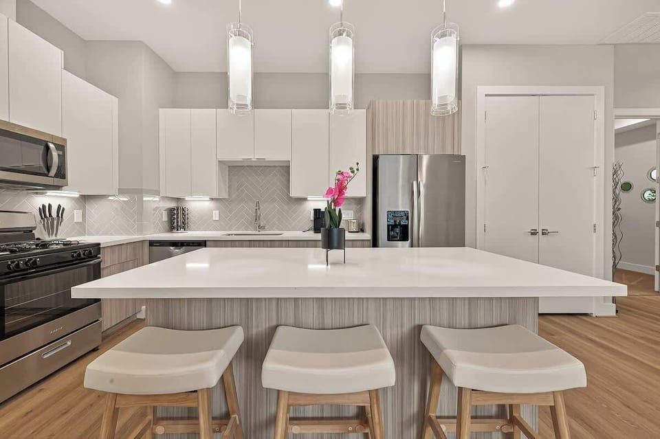 Gourmet Kitchen: Modern design, chic lighting, and a perfect island for your culinary creations