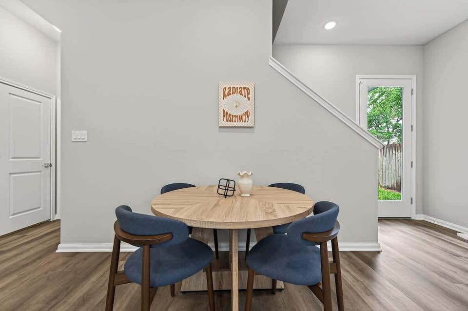 Cozy dining nook with a modern round table and plush seating—perfect for meals, work, or game nights. Bright, inviting, and designed for comfort, this space brings everyone together in a clean, stylish setting.
