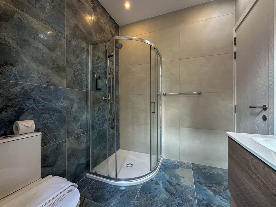 Shower, free toiletries, hair dryer, slippers