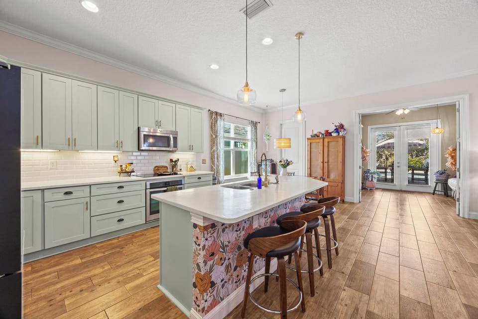Fully equipped modern kitchen with large island — great for cooking and entertaining.