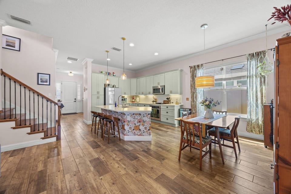 Bright kitchen with modern appliances and dining area — perfect for cooking and gathering.