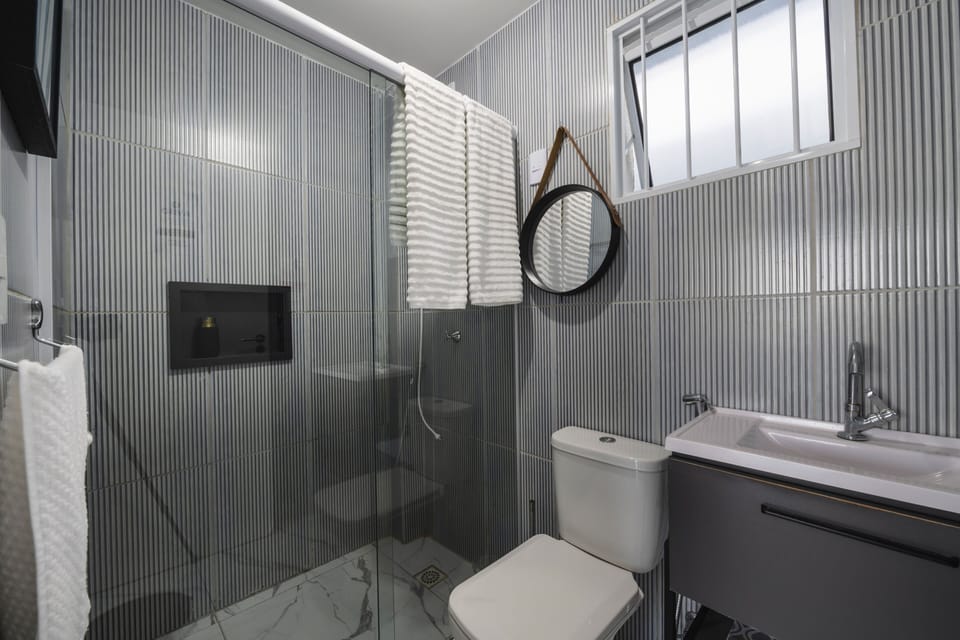 Comfort Apartment, Kitchen, Beach View | Bathroom | Shower, towels, soap, toilet paper