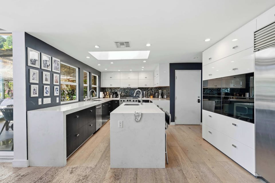Chef's Kitchen with Island, Gallery Wall & Skylight