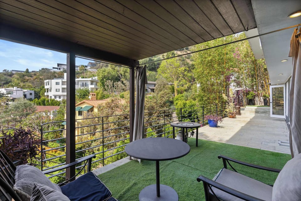 Private Covered Balcony with Bistro Seating & Hillside Views