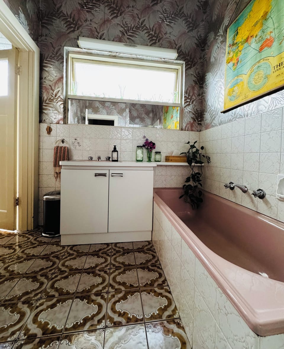 Florence Broadhurst original wallpaper, deep pink bath for use upon request.