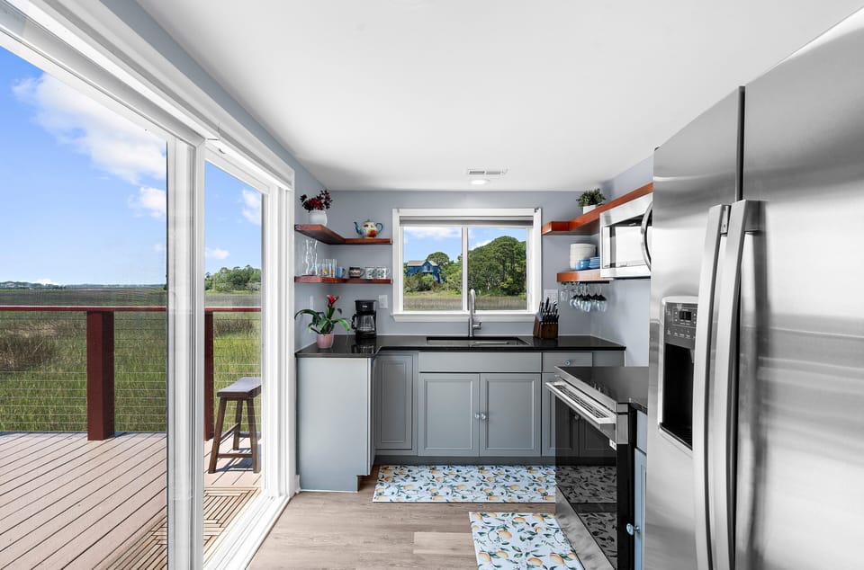 Fully equipped kitchen with brand new stainless steel appliances for your convenience.