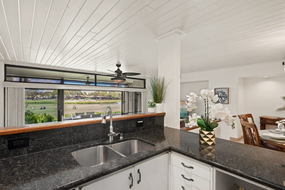 Spacious kitchen counter offers generous prep space and storage.
